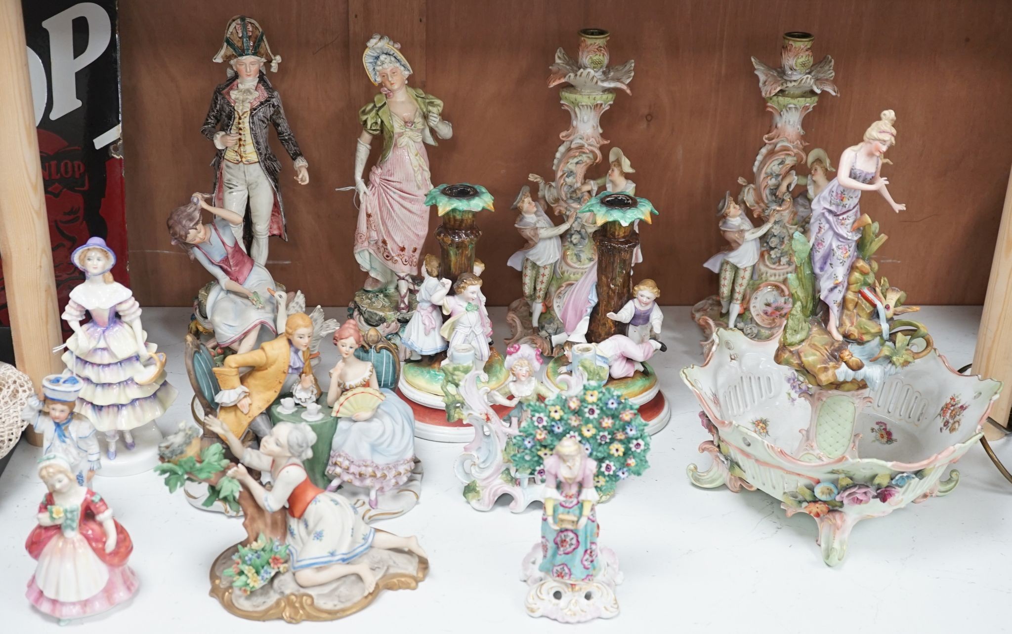 A quantity of various ceramic figures including two Doulton 'Valerie' and 'Meg', tallest figurative candlesticks 34 cms high.